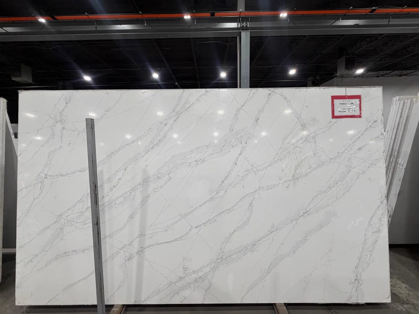 Arabesco Verde quartz slab with branching grey veins, at the stone yard