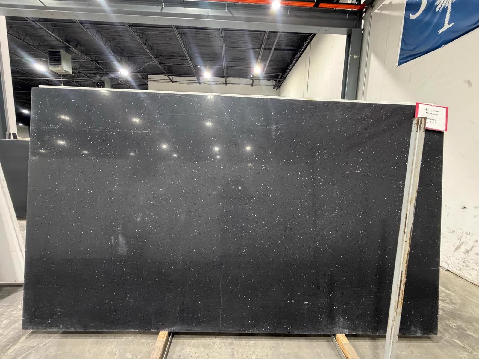 Nero Galaxy MODA quartz slab at the stone yard: black with fine white flecks